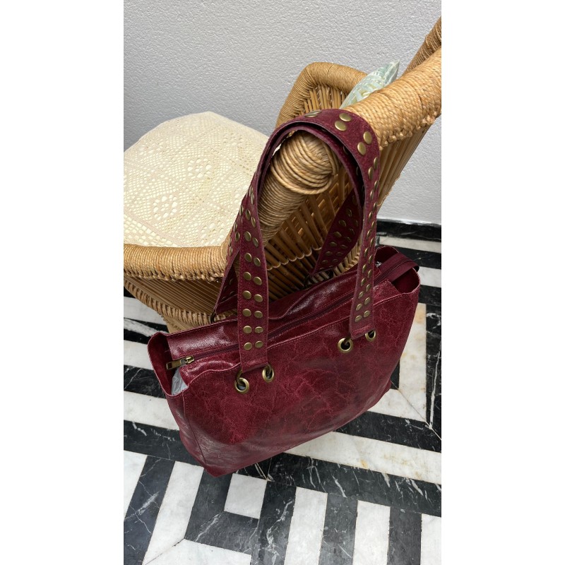 Bolso piel tachas asas