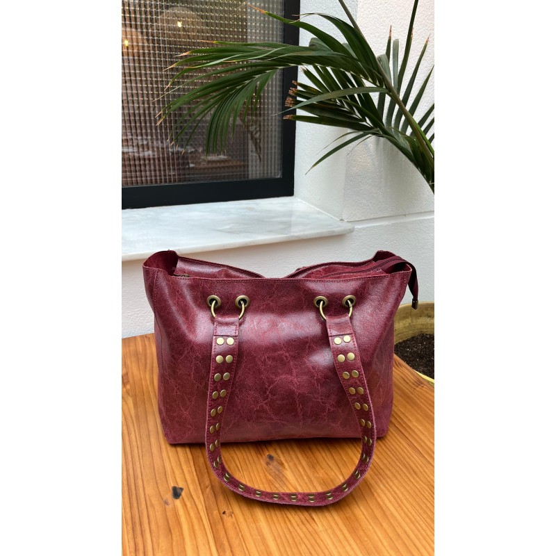 Bolso piel tachas asas